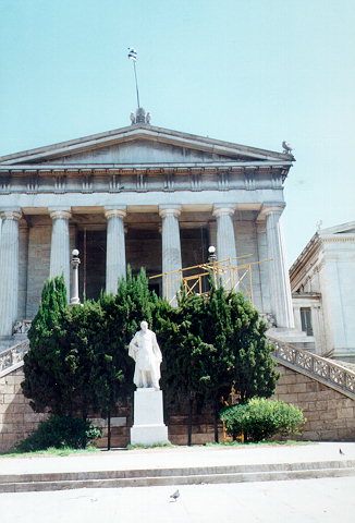 The Vallianios National Library entrance - The National Library forms part of the so-called Neoclassical Trilogy of the City of Athens: Academy - University - Library.
It consists of three solid parts, out of which the one in the middle -which is also the biggest- houses the Reading-Room.