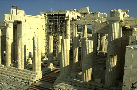 The Propylaia. View of the western facade and central corridor. - There were six Doric columns across the front, with three tall and slender Ionic columns on either side of the central corridor. Photo taken from the Nike Bastion.